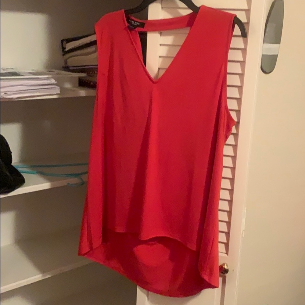 Orange sleeveless top with gorgeous back